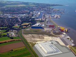 A rendering shows how the wind turbine factory is intended to appear in the eastern harbor area of Cuxhaven, Germany.