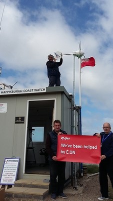 Happisburgh Coast Watch volunteers at their coastal surveillance station featuring the new wind turbine. Treasurer Mark Howson is front left (Image: E.On UK)