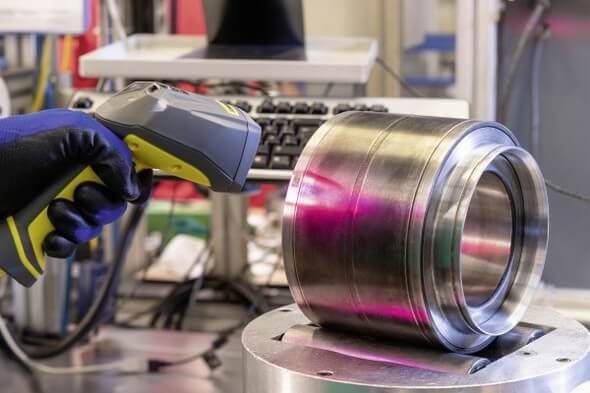 Scanning the data matrix code on a reconditioned axlebox bearing. The DMC ensures quick and easy access to important manufacturing, operating and maintenance data at all times (Image: Schaeffler)