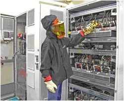 A technician at Woodward’s wind turbine power converter assembly operations in Colorado measures phase currents during the end-of-line test